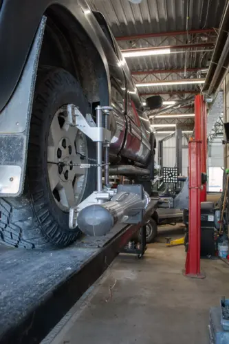 The back end of a truck on a hoist